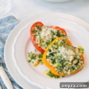 A delicious final plating of couscous stuffed peppers, a perfect vegetarian meal or side dish.