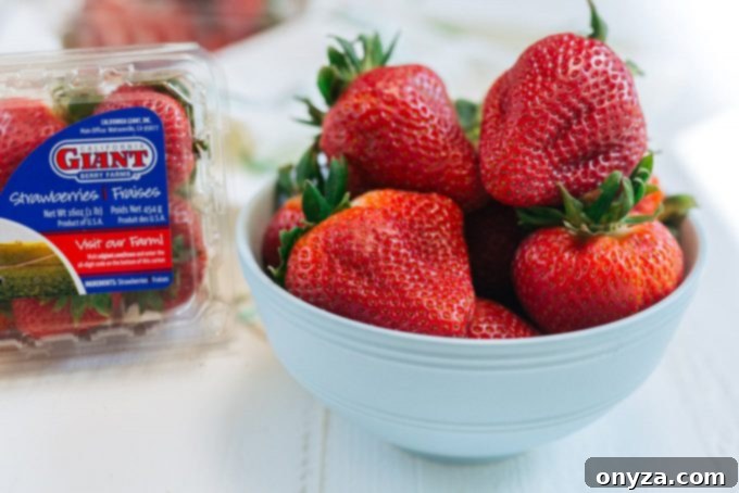 Gorgeous California Giant Strawberries! | Striped Spatula Fresh California Giant Berry Farms strawberries in a bowl, highlighting their natural beauty and readiness for dipping.