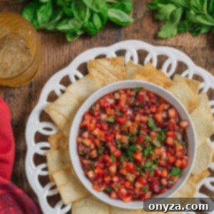 Sweet and Savory Strawberry Balsamic Salsa 2 Fresh strawberry balsamic salsa served in a white bowl with a spoon