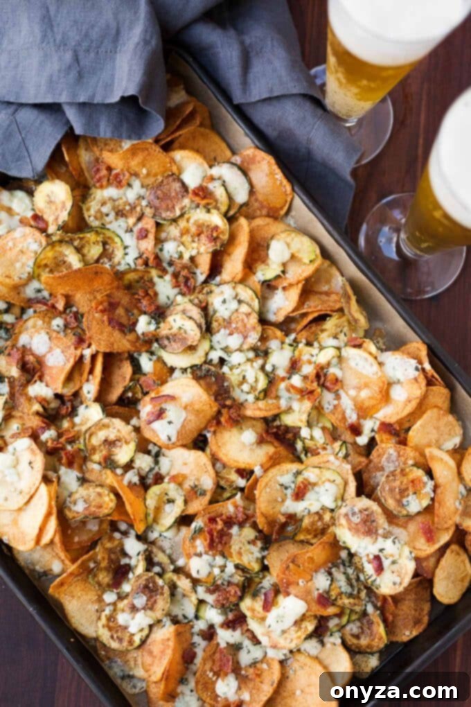 Gourmet homemade potato and zucchini chips with bacon, gorgonzola, and thyme