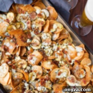 Gourmet homemade potato and zucchini chips with bacon gorgonzola and thyme