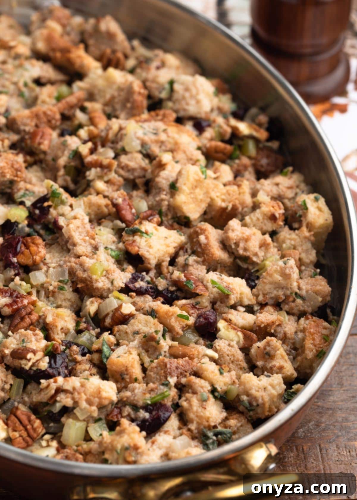 Festive Cranberry Pecan Stuffing 4 assembled cranberry stuffing in a tin-lined copper gratin pan before baking