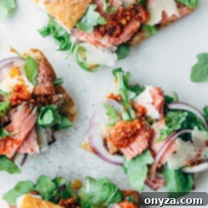 Gourmet Roast Beef Sandwiches with Sun-Dried Tomato Pesto 5 Open-faced roast beef sandwiches with baby arugula and pesto rosso