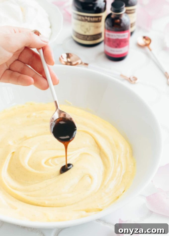Stirring Nielsen-Massey vanilla bean paste into creamy pastry cream, a key step for flavorful desserts (sponsored)