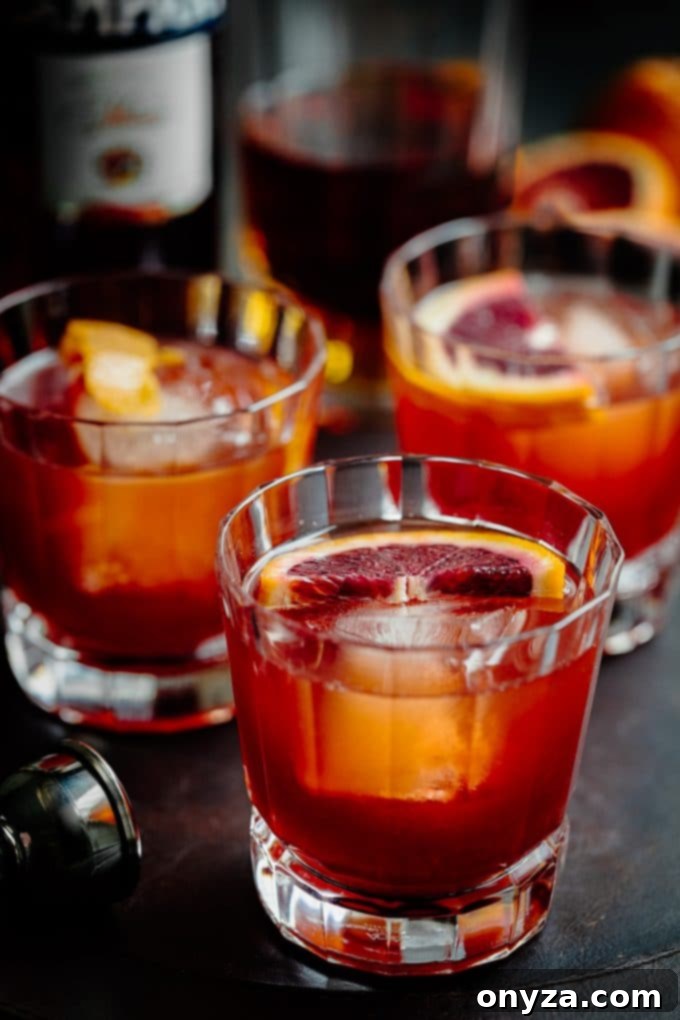 Boulevardier Rouge 5 Two Blood Orange Boulevardier cocktails garnished with fresh blood oranges