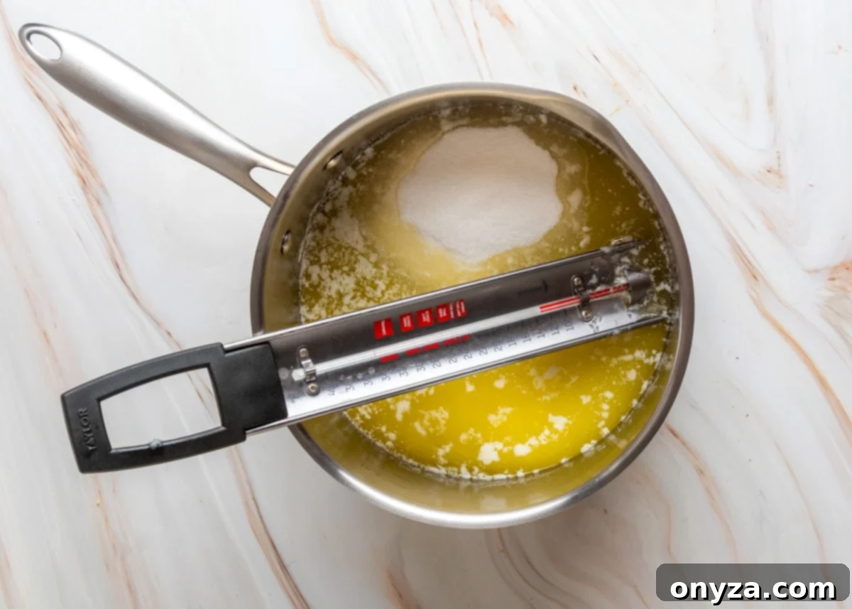 Butter and sugar mixture melting in a saucepan at the beginning stages of toffee making.