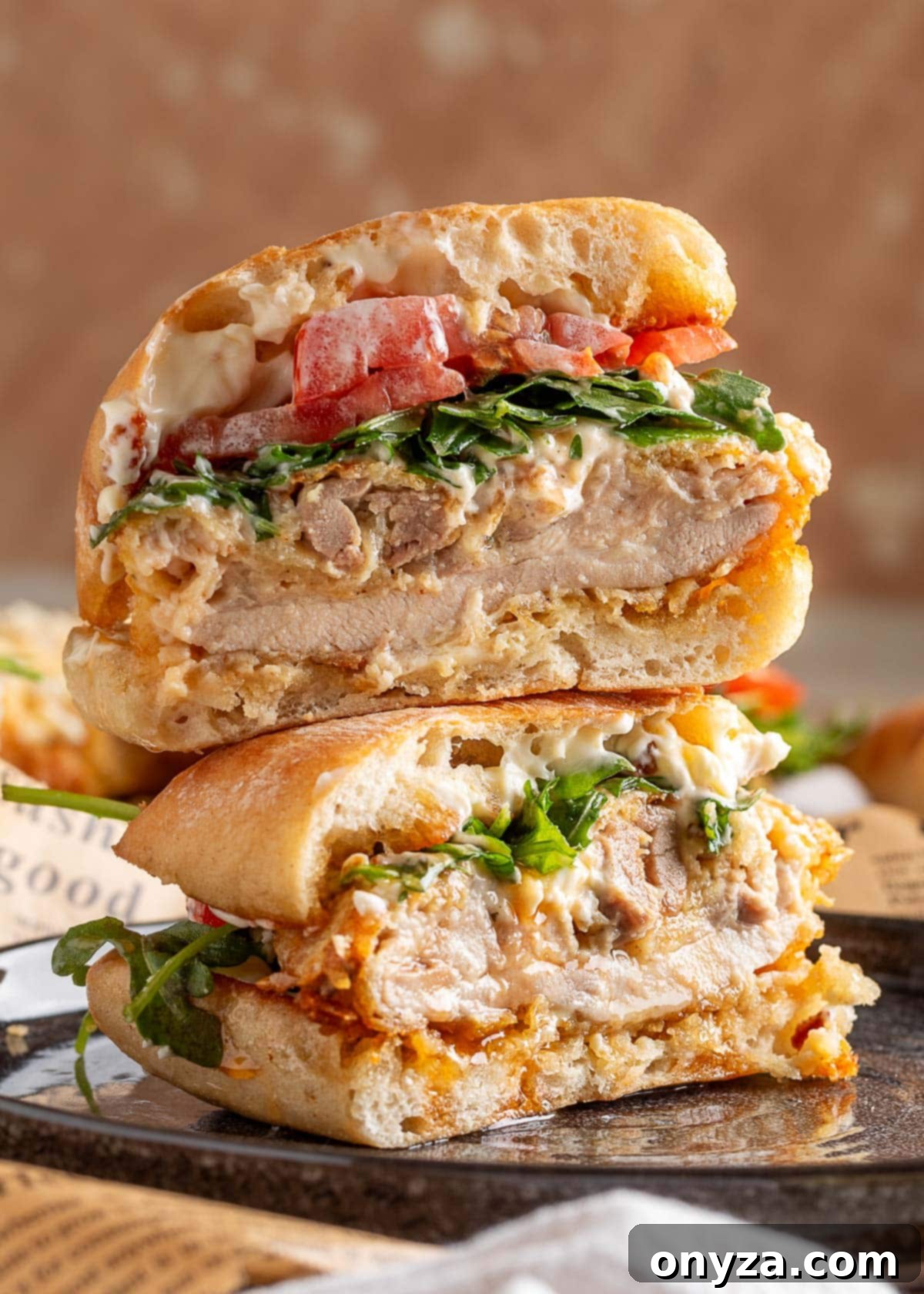 Juicy air-fried chicken sandwich with arugula, tomato, and mayo