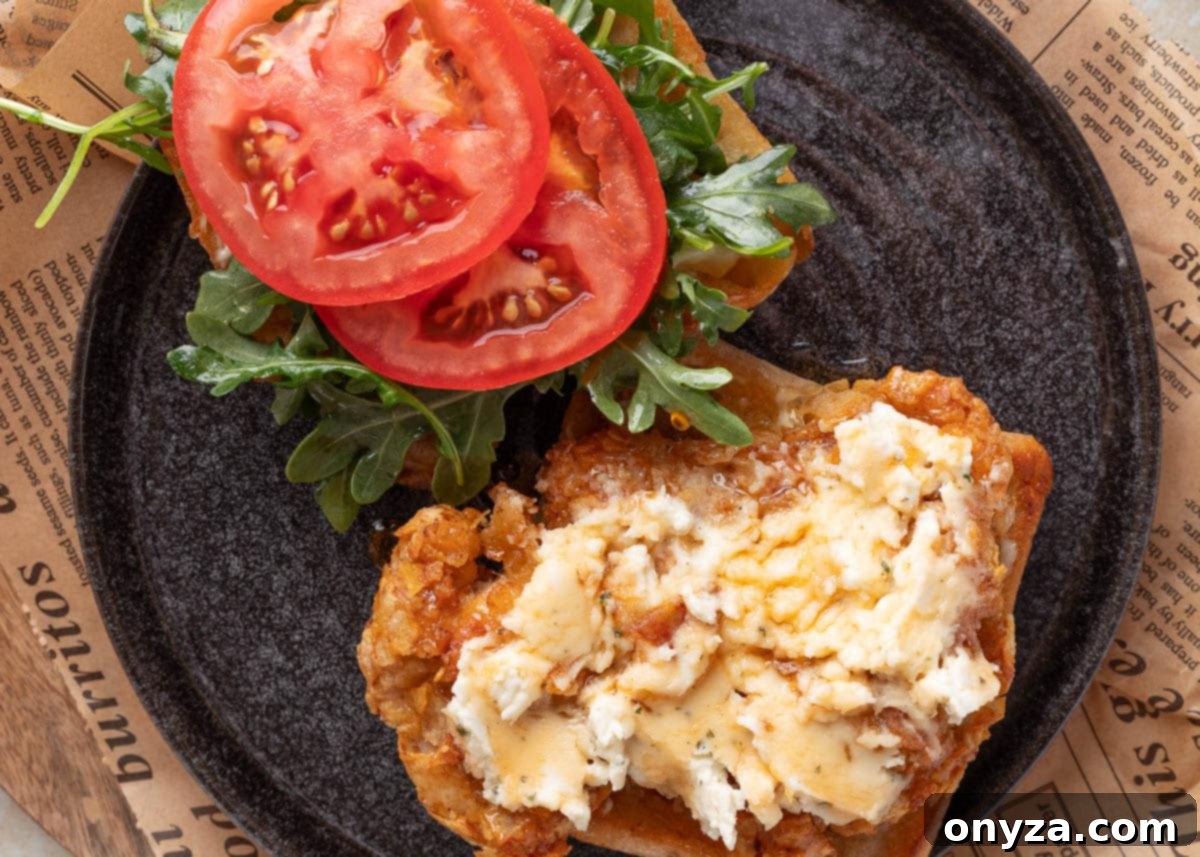 Open-faced air fryer chicken sandwich with Boursin and hot honey