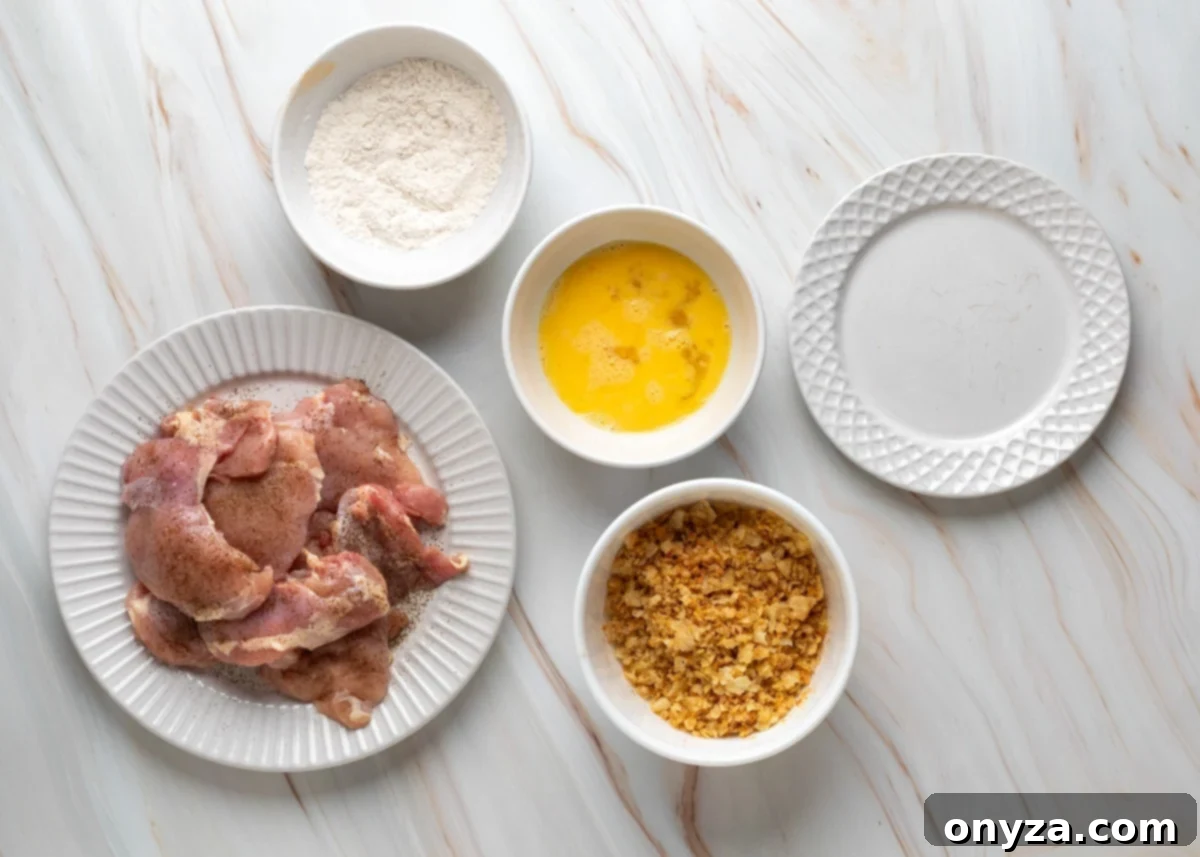 Breading station setup for Potato Chip Chicken.